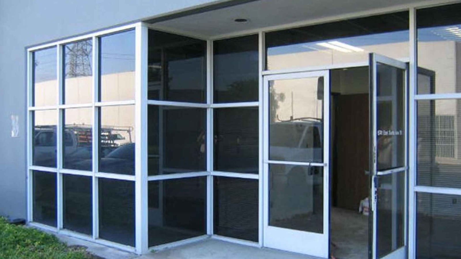 Commercial glass door with security lock and metal handles, installed by Accurate Security And Lock in Algonquin, IL.