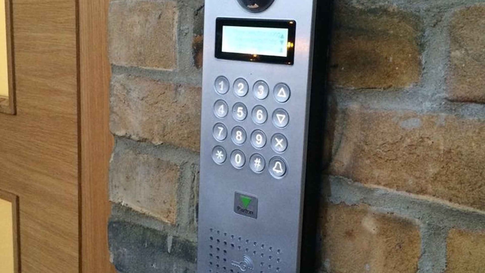 Commercial access control keypad with a numeric interface, installed on a door for a business in Algonquin, IL.