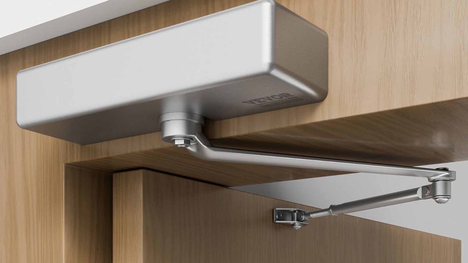 Professional installation of a door closer on a commercial door, a service provided to businesses in Arlington Heights, IL.